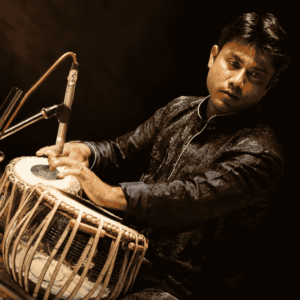 Professional Tabla Artist performing Indian Classical Music on stage during a live concert performance